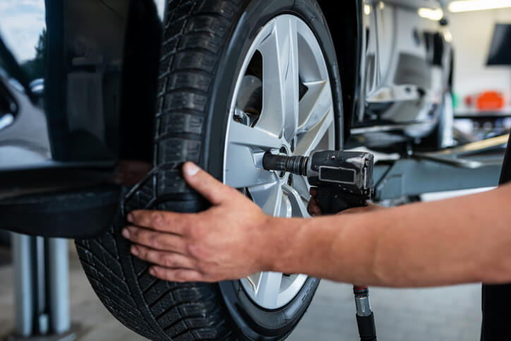 Inspecting the tire of Used Pickup Truck on Craigslist