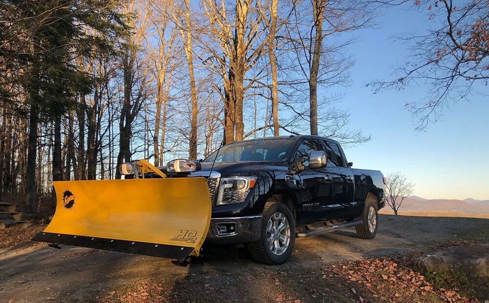 Affordable Used snow plow trucks for sale on Craigslist - Nissan Titan XD with a snow plow attachment