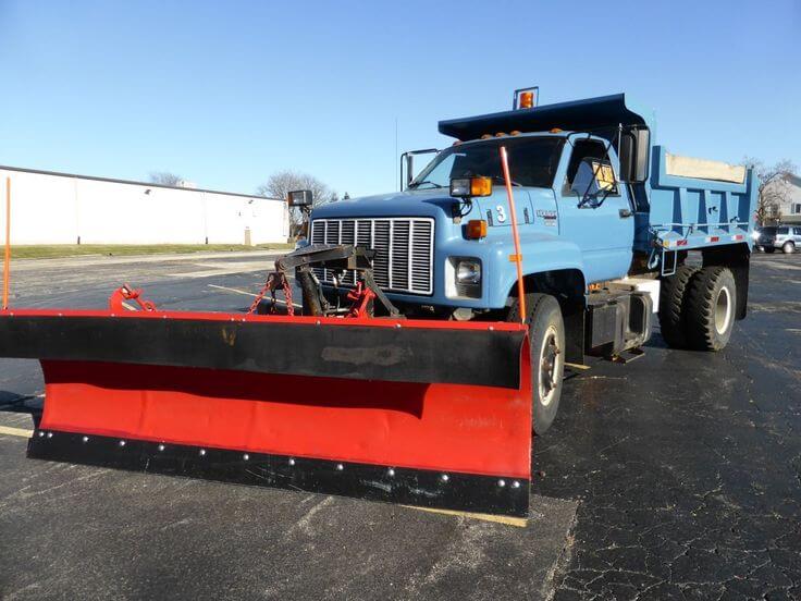 Chevrolet Kodiak with a snow plow attachment